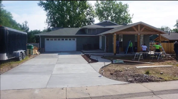 Professional concrete driveway and stone patio installation in Aurora, Colorado